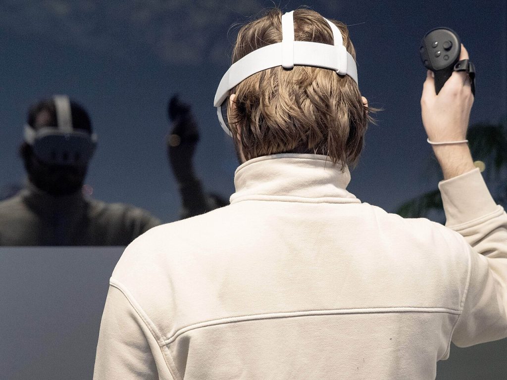 Virtuix to Sell Omni One VR Treadmills Bundled With Quest Person playing an immersive virtual reality game wearing a headset