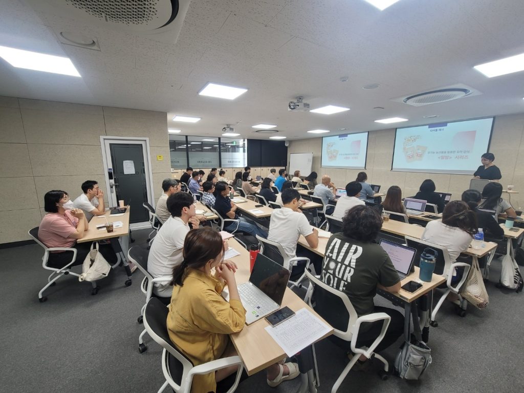 Students in a classroom with smartphones put away during a lesson, illustrating a study of phone bans and academic performance